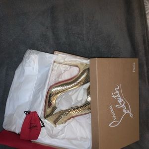 Gold pigalle christian louboutin heels.